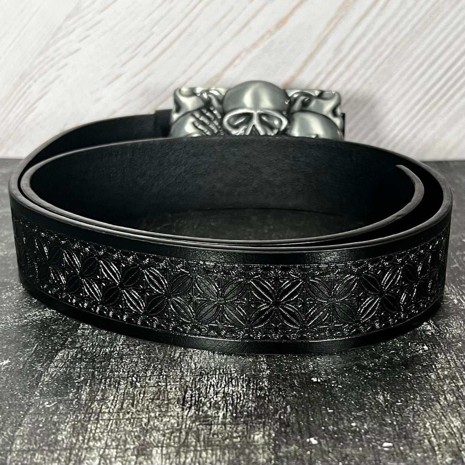 Gothic punk TornSlayer Skull Belt with "Three Wise Skulls" buckle, unisex faux leather design.