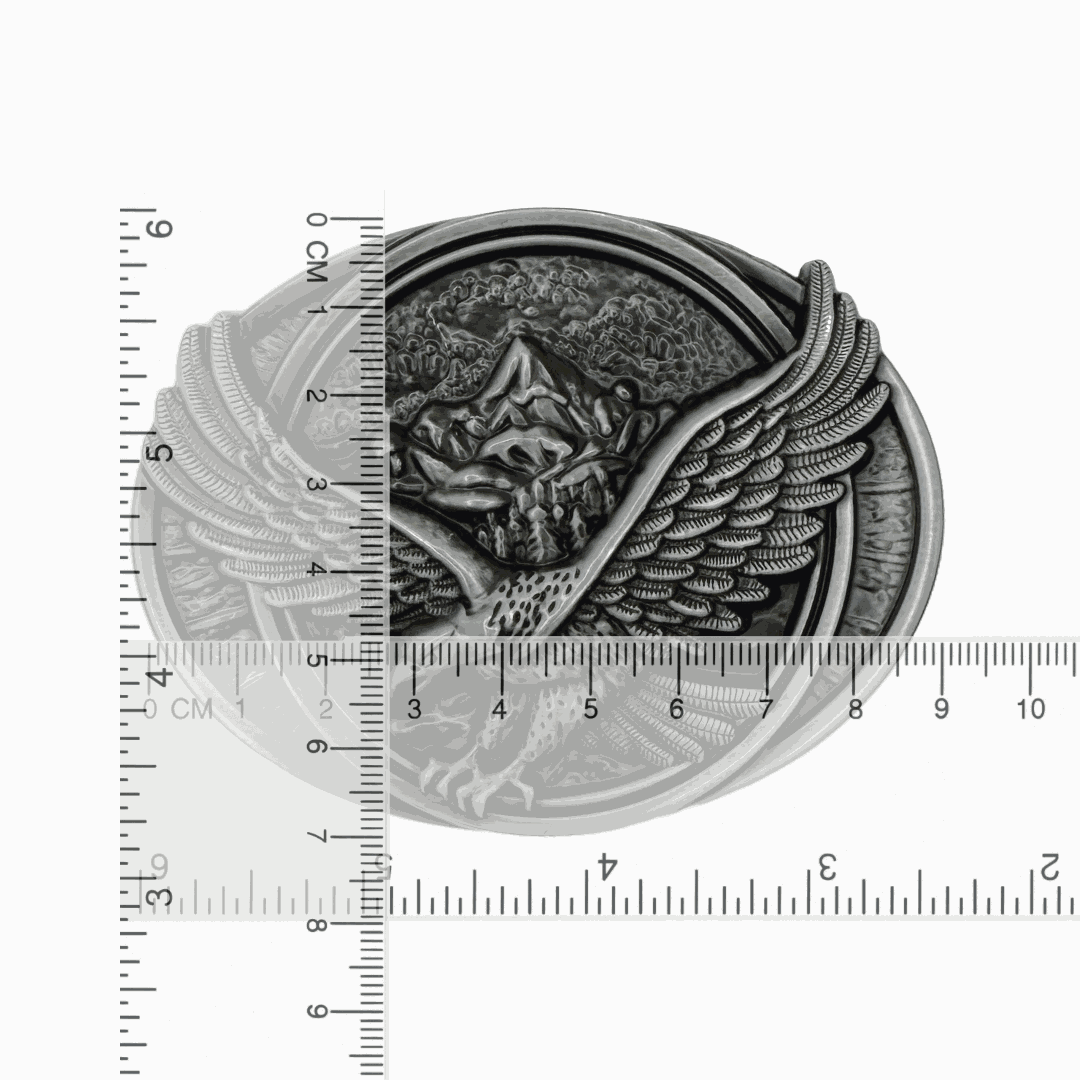 Antiqued silver-tone eagle belt buckle with soaring eagle and mountain design