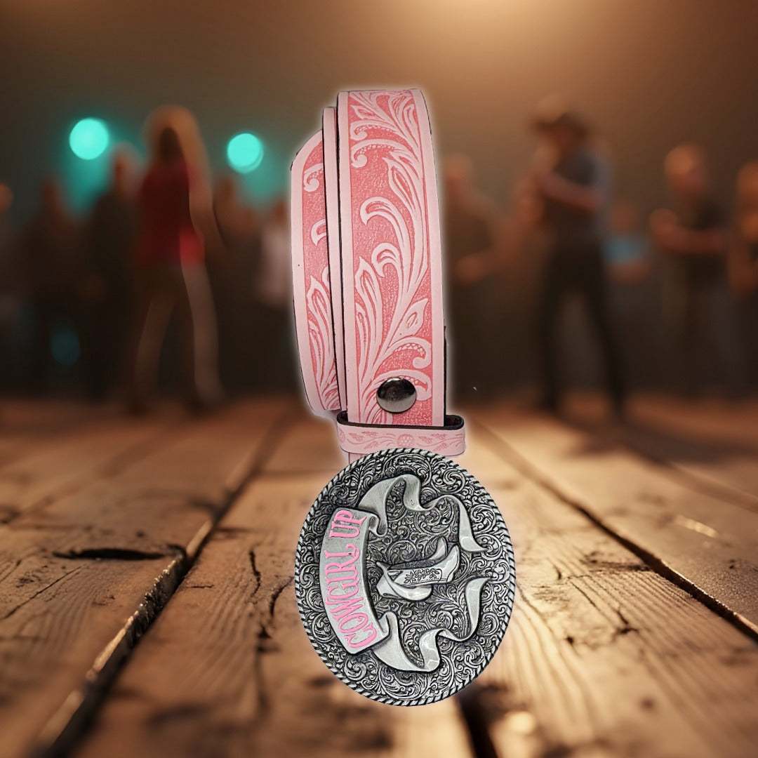 Pink Cowgirl Up Belt with faux leather embossed scroll patterns and silver oval buckle featuring cowboy boots and pink "Cowgirl Up" lettering