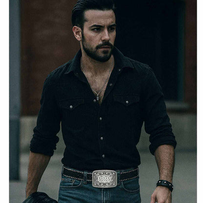 Man wearing studded gothic belt with 666 buckle and black shirt