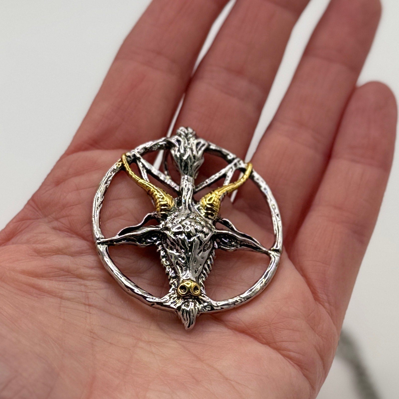 TornSlayer Goat Head Pentagram Necklace in silver and gold.