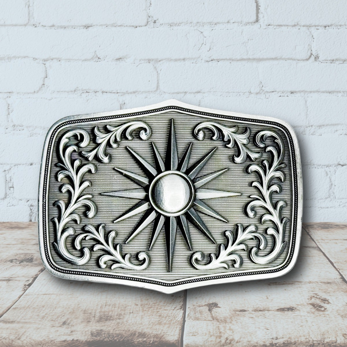 Antique silver boho sunburst belt buckle with floral engravings and western design