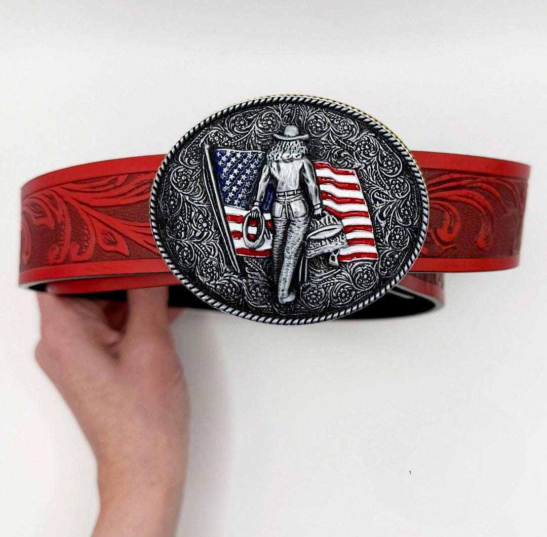 American Crush Western Belt featuring red tooled faux leather and a silver oval buckle with embossed cowgirl and USA flag design