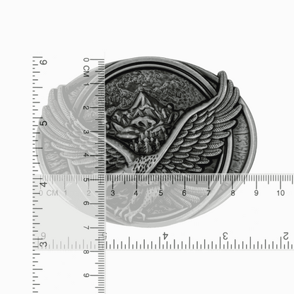 Antiqued silver-tone eagle belt buckle with soaring eagle and mountain design