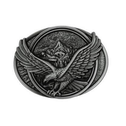 Antiqued silver-tone eagle belt buckle with mountain design, oval shape, removable hardware
