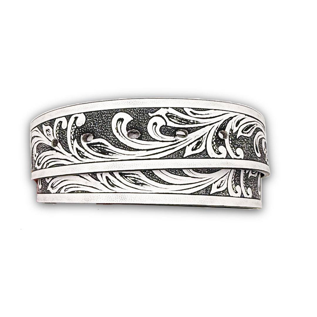 White vegan leather belt strap with a tooled floral design and snap-on buckle feature.