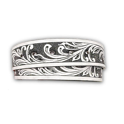 White vegan leather belt strap with a tooled floral design and snap-on buckle feature.